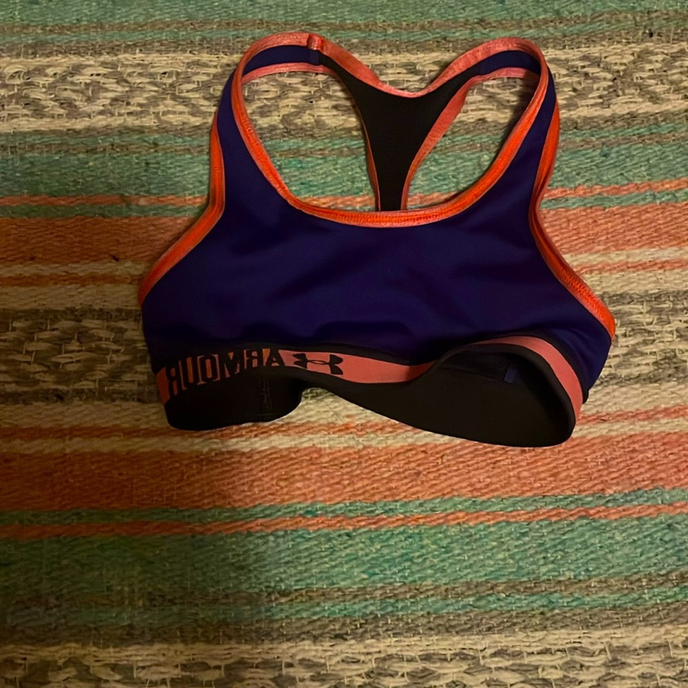 I am selling this purple and orangey pink sports bra it is under armor